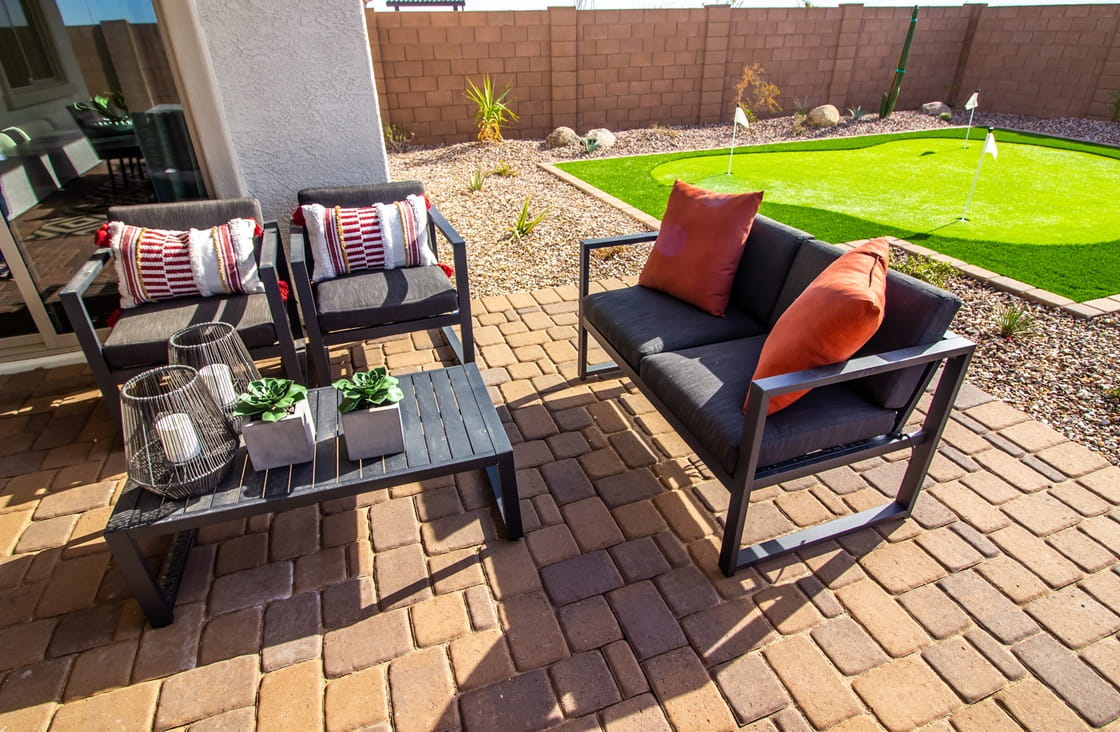 A compact putting green integrated alongside a patio